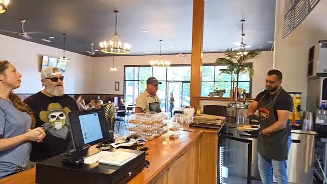 Music City Gyros team serving guests at the counter